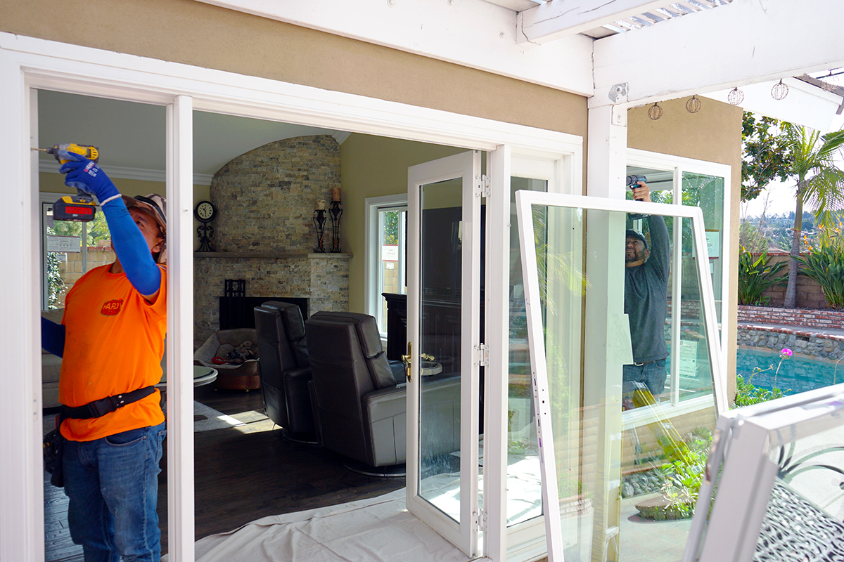 Members of our crew working on a window and door