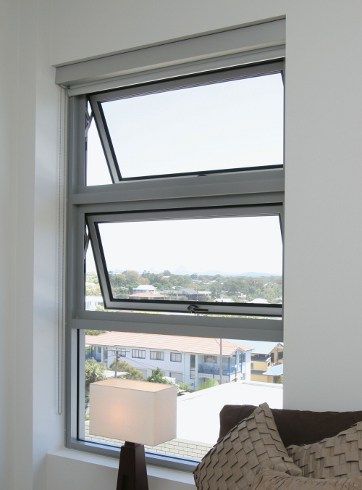 Two stacked awning windows hinged at the top and open outward at the bottom