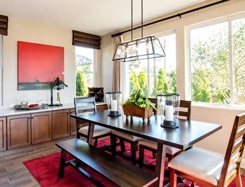 Modern dining room with large replacement windows and natural light in Cedar Park home