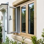 Modern exterior home window replacement with wood frames and energy-efficient glass