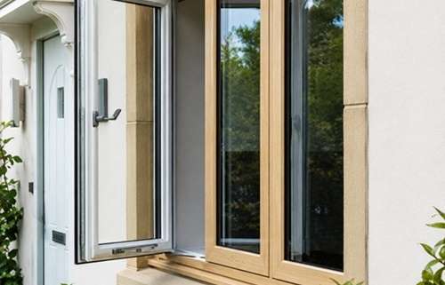 Modern exterior home window replacement with wood frames and energy-efficient glass