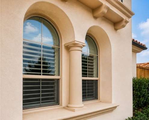 Window replacement in Cedar Park, TX featuring energy-efficient arched windows on a stucco home